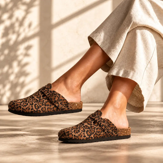 Leopard print genuine suede mule clogs worn on feet
